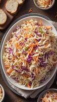 Creamy coleslaw salad, a refreshing and flavorful dish combining shredded cabbage, carrots, and a tangy dressing, a perfect side for any meal. photo