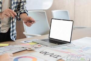 UXUI designer creating wireframes and prototypes at a modern workspace with laptop. photo