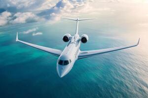 Generic private jet flying over the ocean on a sunny day photo