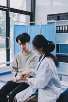 A doctor is examining a patient in a hospital photo