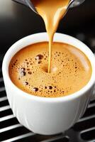 Barista skillfully extracts a rich espresso shot in a cozy coffee shop setting with steam and crema enhancing the artisanal experience photo