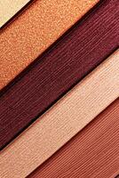 Vibrant close-up of rich burgundy eyeshadow showcasing detailed textures and luxurious finishes in a well-lit setting photo
