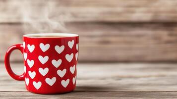 Cozy red mug with white heart patterns sits on rustic wooden surface, steam rising from a warm drink in a welcoming atmosphere photo