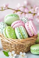 Rustic basket filled with pastel homemade Easter macarons adorned with hand-painted patterns amid a soft-focus spring backdrop photo
