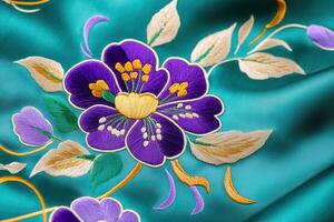 Intricate silk embroidery in emerald green and violet showcasing floral motifs with a vintage royal textile aesthetic emphasizing elegance and luxury photo
