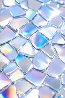 Mosaic of small mirrored tiles reflects light creating an abstract pattern with a futuristic and glamorous aesthetic photo