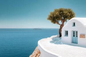 Whitewashed house overlooking the Aegean Sea in Santorini, Greece photo