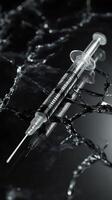 Syringe reflecting on broken glass with liquid spilling photo