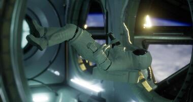Astronaut conducts experiments inside a space station with Earth in view video