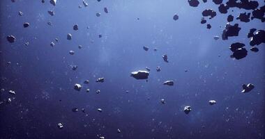 Expansive view of numerous asteroids floating in deep space video