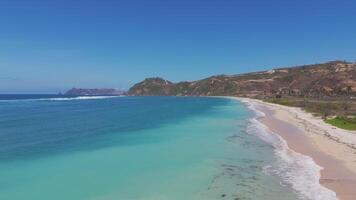 Aerial view of pristine beach with turquoise waters in Lombok, Indonesia video