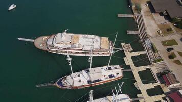 View from top to bottom on the decks of moored sailing yachts video
