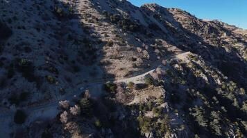 Aerial view of a high-altitude mountain road with a distant sea video