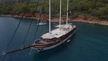 Aerial. sailing yachts are moored in a beautiful bay with transparent water video