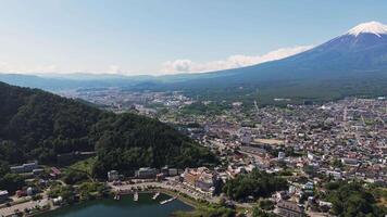 aerial view of a town near lake Kawaguchiko with Mount Fuji in view video