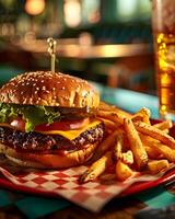 A hamburger and french fries on a checkered table photo
