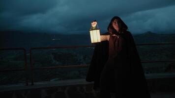 Woman Walks Mysteriously In A Square At Night Among The Darkness Of The Crime photo