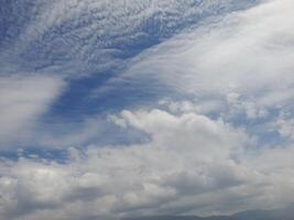 Light blue sky with clouds, can be used as a background. photo