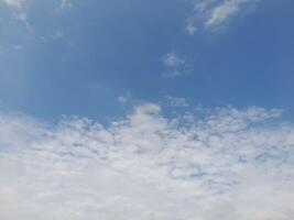 Beautiful grey clouds on sky background. Large bright soft fluffy clouds are cover the entire sky photo