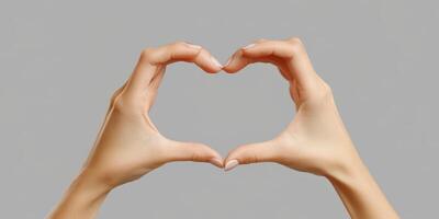 Hands create a heart shape symbolizing love and connection during a warm moment of joy and appreciation photo