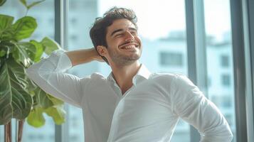 A man in a white shirt is smiling photo