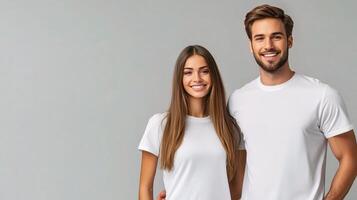 A man and woman in white t - shirts standing together photo