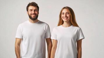 A man and woman in white t - shirts standing next to each other photo