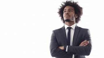 A man in a suit and tie standing with his arms crossed photo
