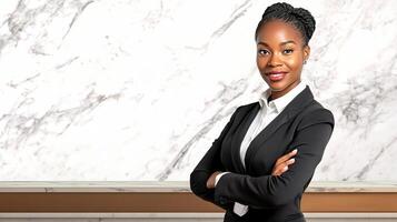 A woman in a business suit standing in front of a marble wall photo