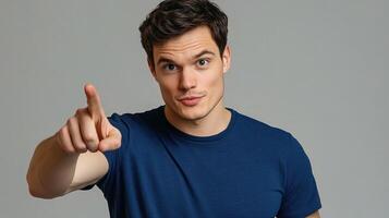 A man pointing at something with his finger photo