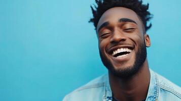 A smiling black man with dreadlocks photo