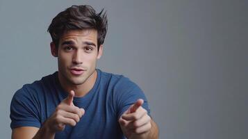 A man is pointing at something with his finger photo