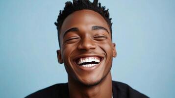 A man with dreadlocks is smiling photo