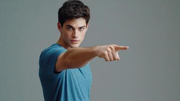 A man pointing at something with his hand photo