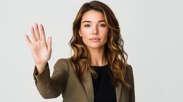 Businesswoman Making Stop Sign Gesture to Convey Message of Halt photo