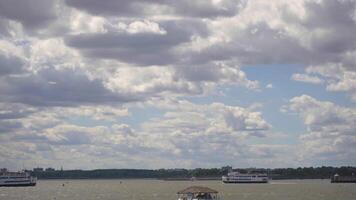 Serene Waterfront with Ferries and Cloudy Sky in New York video