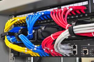 Network cables arranged in a data center for organized connectivity and efficient data transmission photo