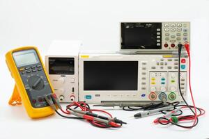 Electronics workbench showcasing multimeter, oscilloscope, and power supply for circuit testing and analysis photo