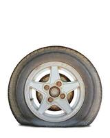 flat tire with rusty alloy wheel on white background. Clipping path photo