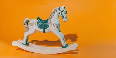 A carousel horse carved from white marble with gilded mane and tail. Intricate golden designs photo