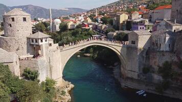 Aerial view of the Old Bridge of Mostar. Stari Most with city background on a sunny day in summer video