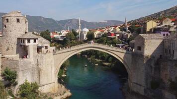 Aerial view of the Old Bridge of Mostar. Heritage of Stari Most with city background on a sunny day video