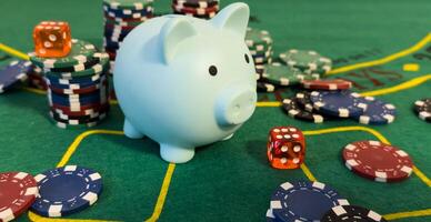 Piggy bank surrounded by a pile of assorted casino chips conceptual of success photo