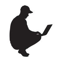 Silhouette of a person crouched down working on a laptop. vector