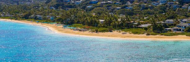 Aerial View of a Beach with Boats and Palm Trees on Oahu Island photo