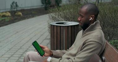 A man is talking on a chat on his phone video