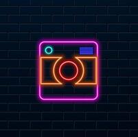 Glowing neon line Photo camera icon isolated on black background. Photo camera. Digital photography. vector