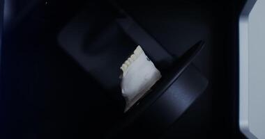 Close-up scanning of a cast of the jaw in different planes to create dentures. The work of an orthodontist. No people. in 4k, red komodo video