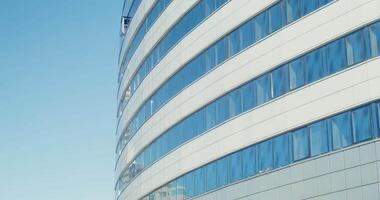Semicircular building of a business center with panoramic windows, close-up, filming in the light of day video