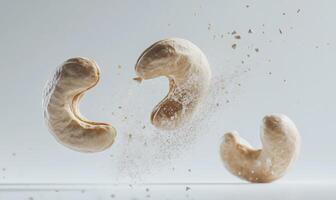 Three cashews are flying through the air photo